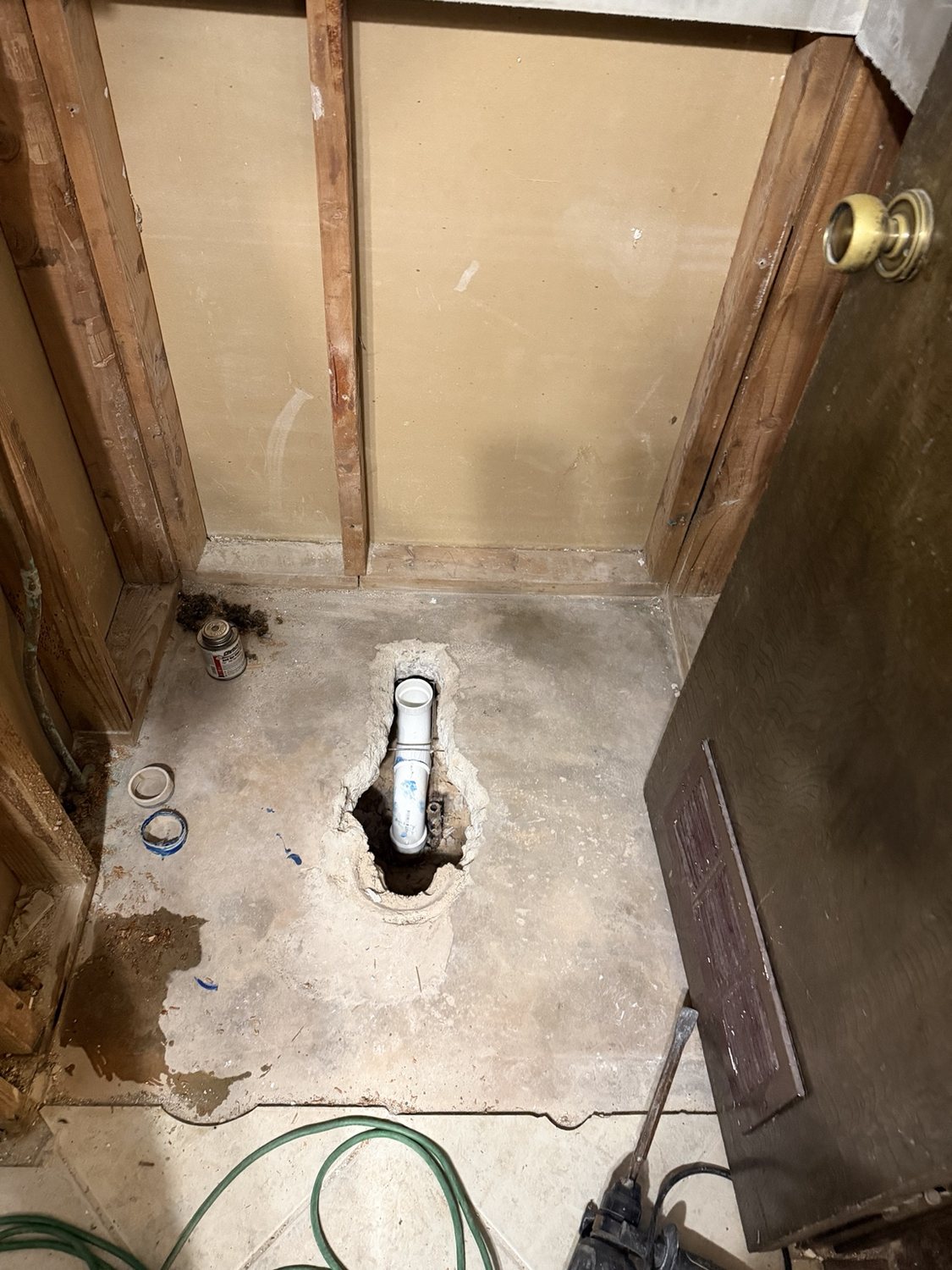 Custom shower demolition and drain access during a Total Home Care bathroom remodel