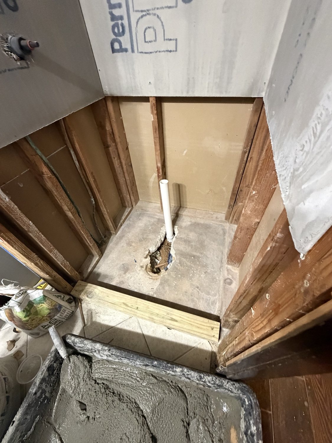 Drain plumbing preparation for a custom shower remodel