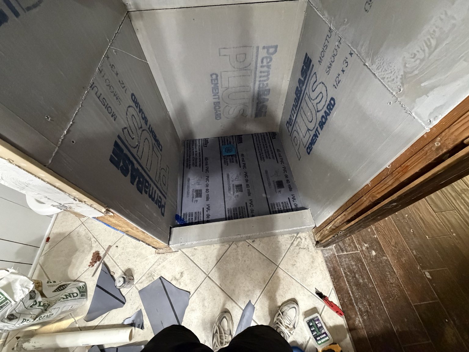Shower floor waterproofing membrane during construction